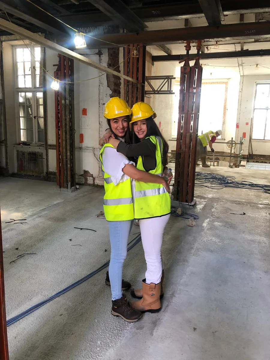 Monica and a colleague on a construction site in 2018