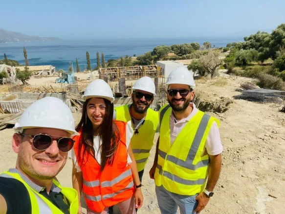 Monica with the project team on a construction site in Kefalonia